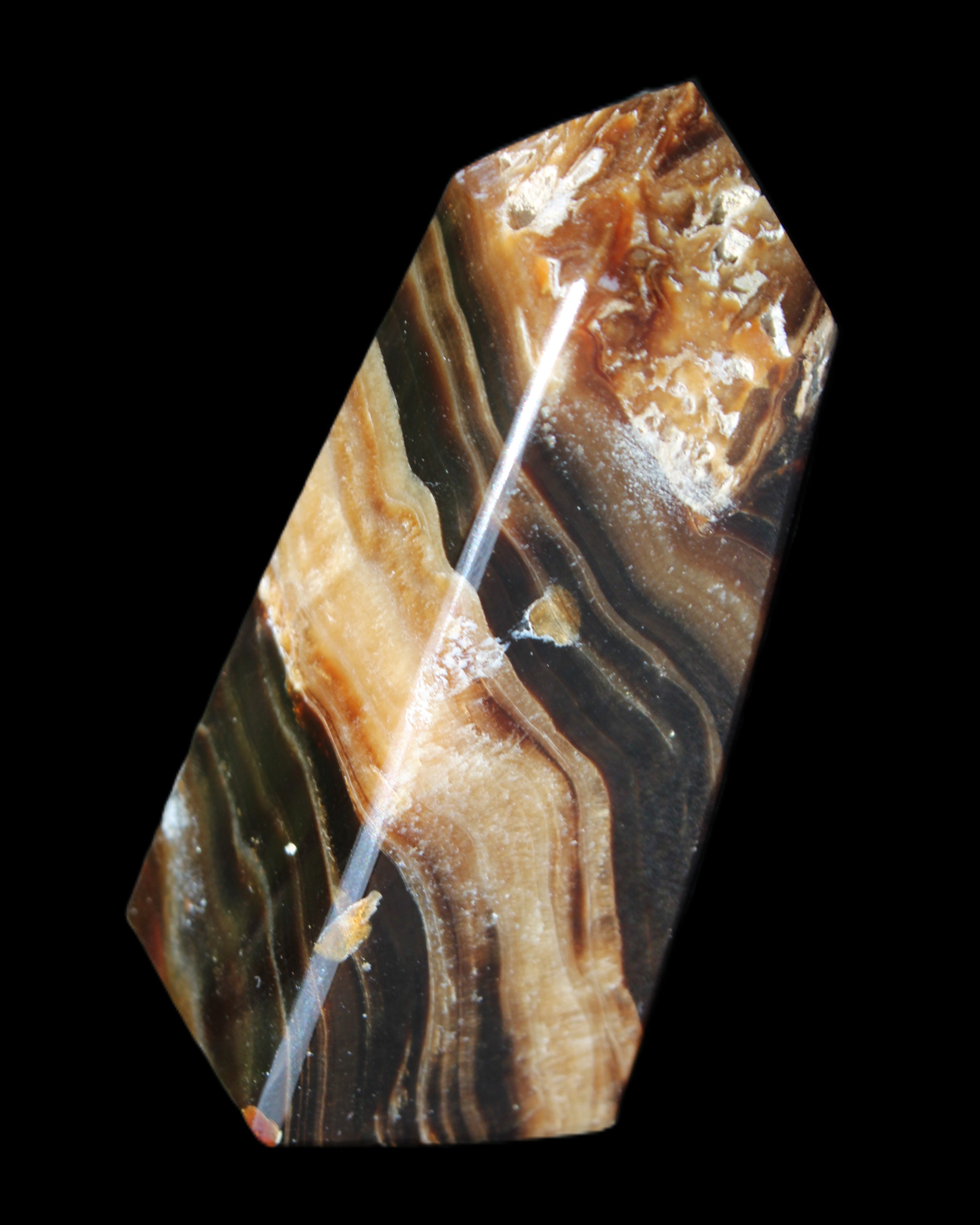 Chocolate Calcite obelisk 83*32*30mm 147.5g in sunlight - Rocks and Things Store