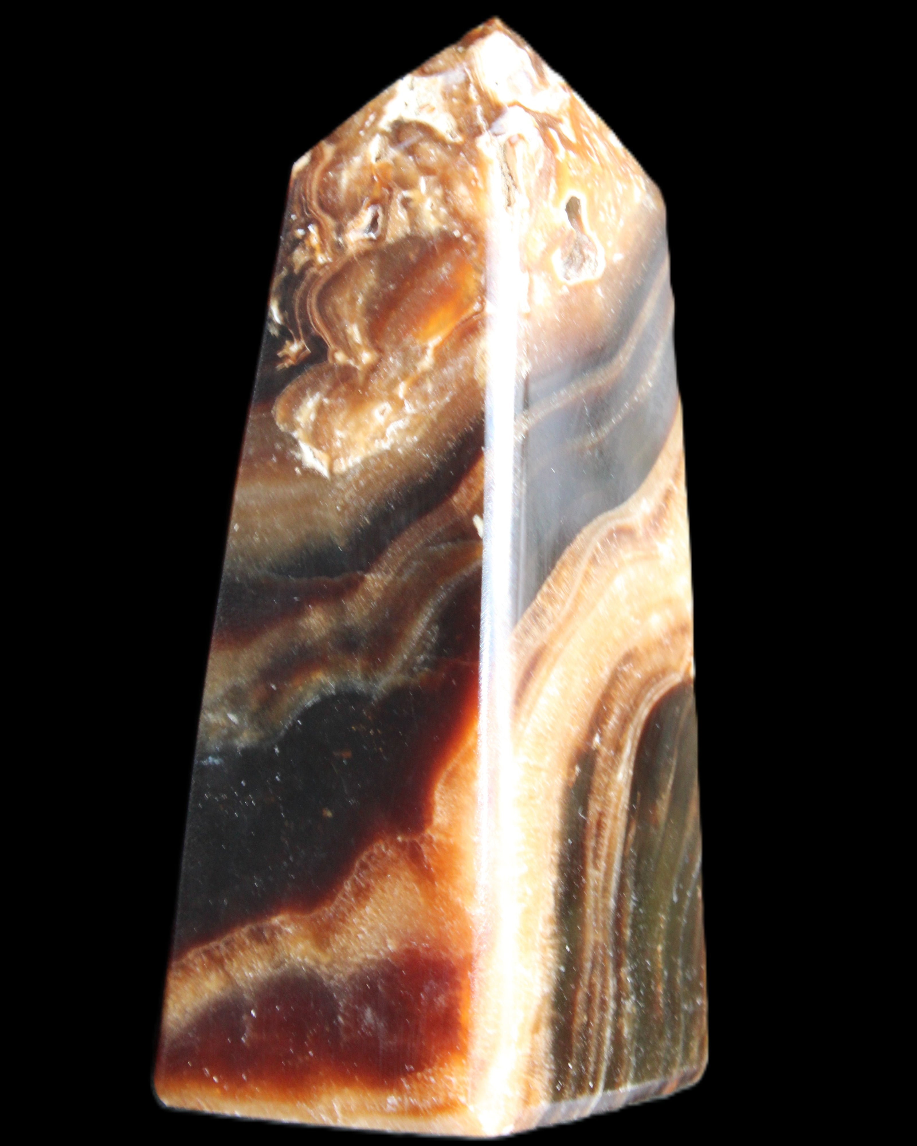 Chocolate Calcite obelisk 83*32*30mm 147.5g in sunlight - Rocks and Things Store