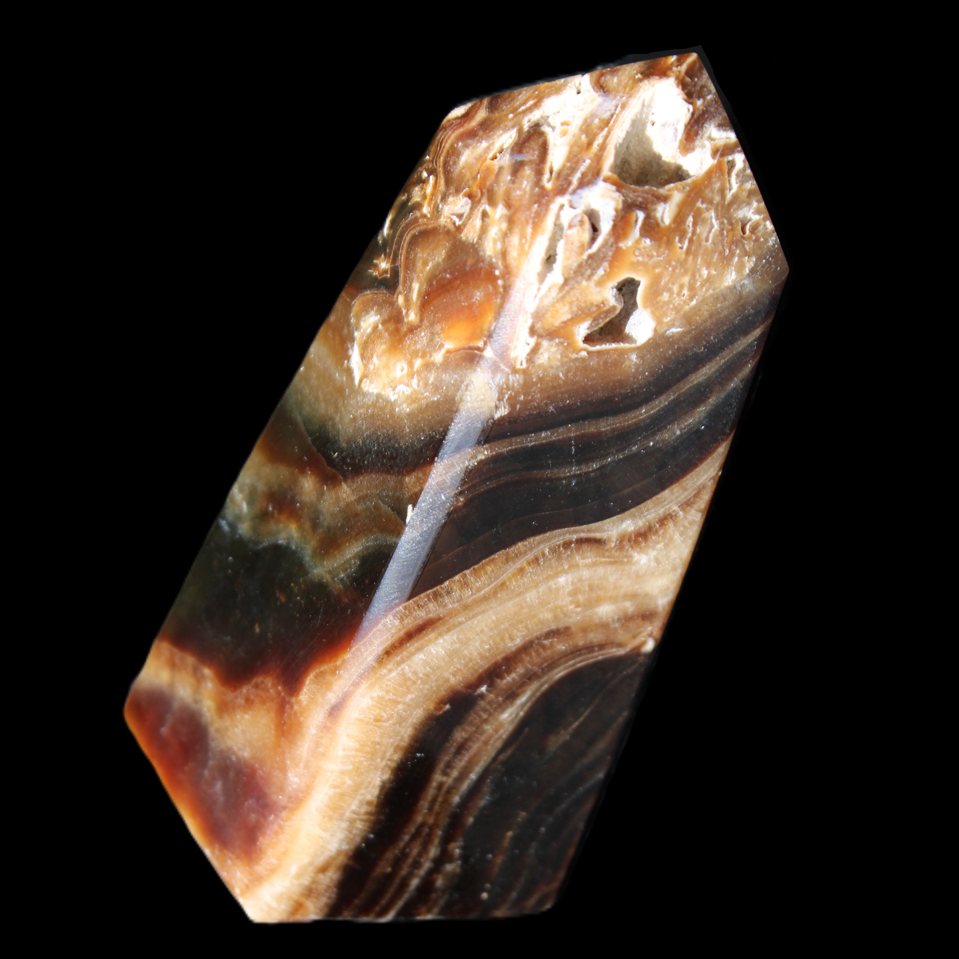 Chocolate Calcite obelisk 83*32*30mm 147.5g in sunlight - Rocks and Things Store