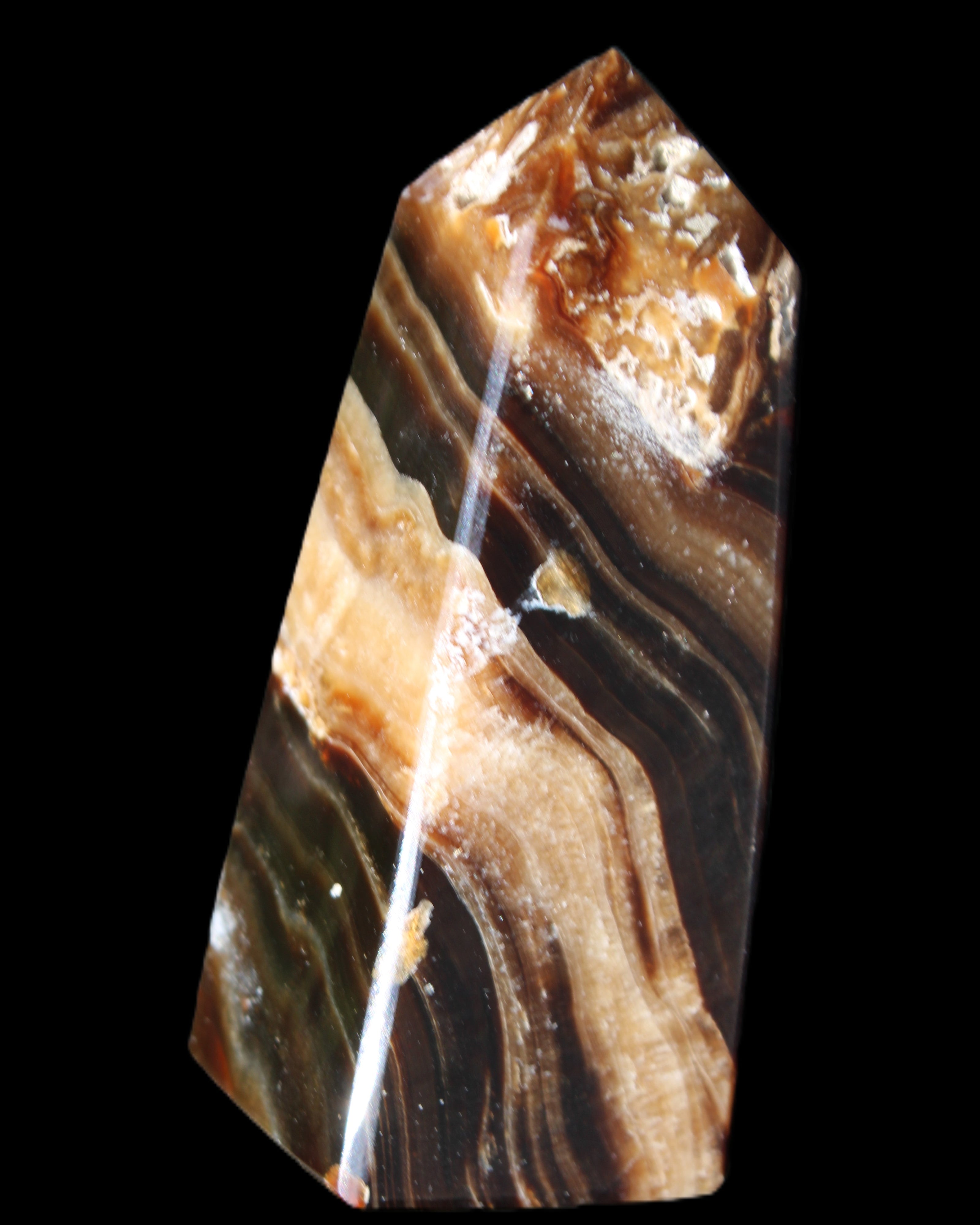Chocolate Calcite obelisk 83*32*30mm 147.5g in sunlight - Rocks and Things Store