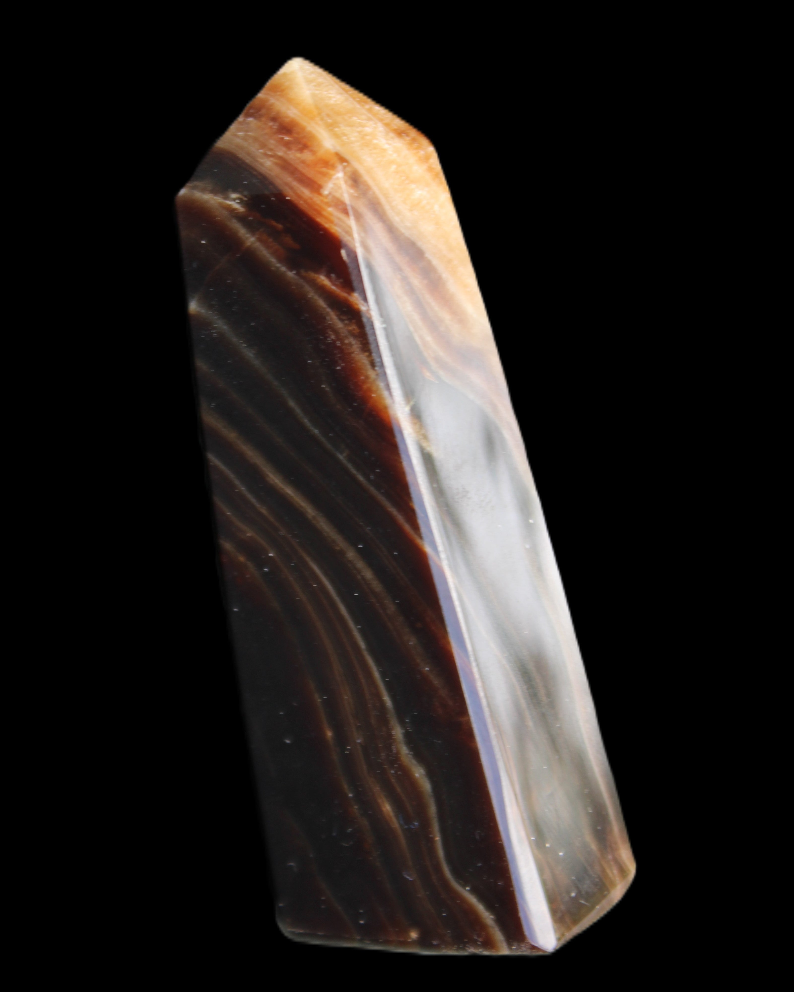 Chocolate Calcite obelisk 78*29*18mm 84g in sunlight - Rocks and Things Store