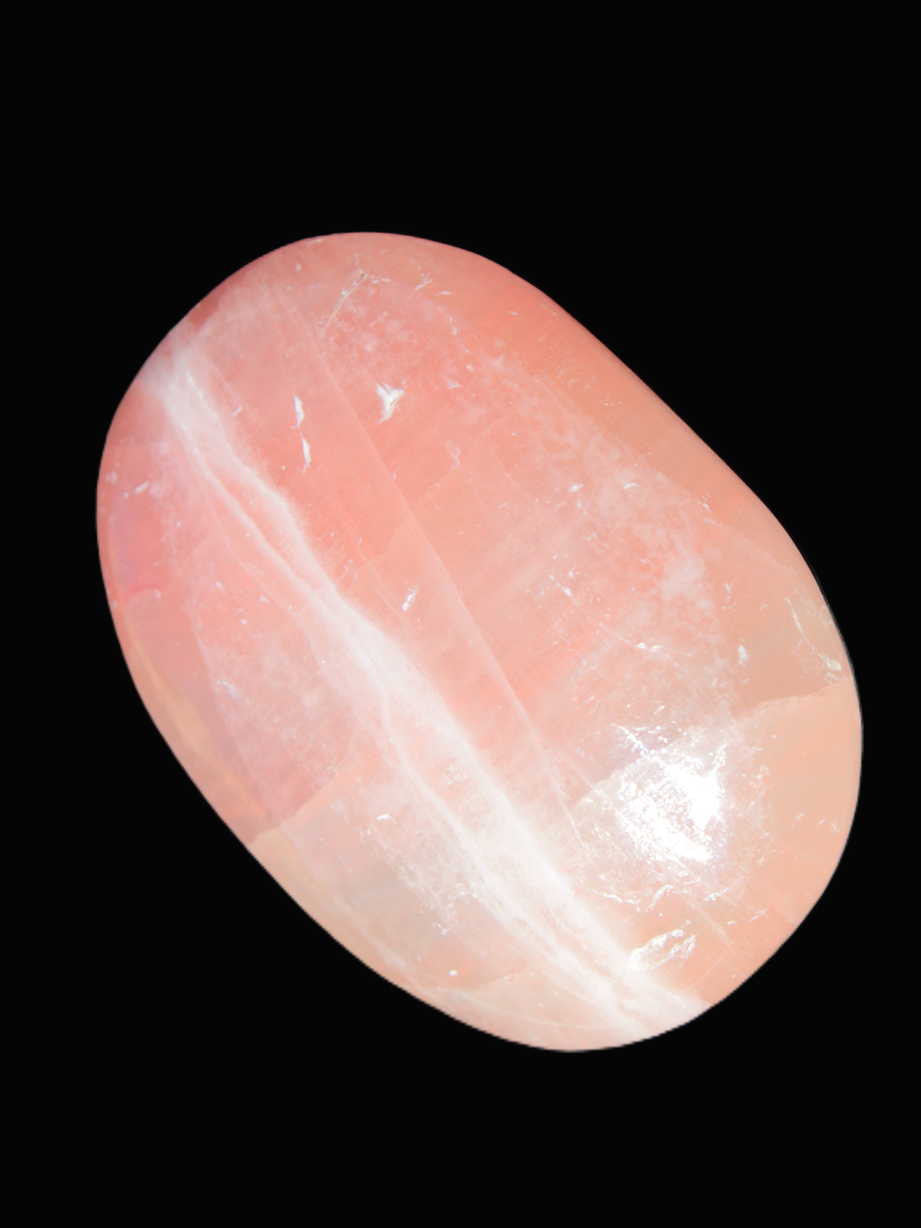 Pink Sorbet Calcite palm stone 57-61mm 71-117g in sunlight - Rocks and Things Store