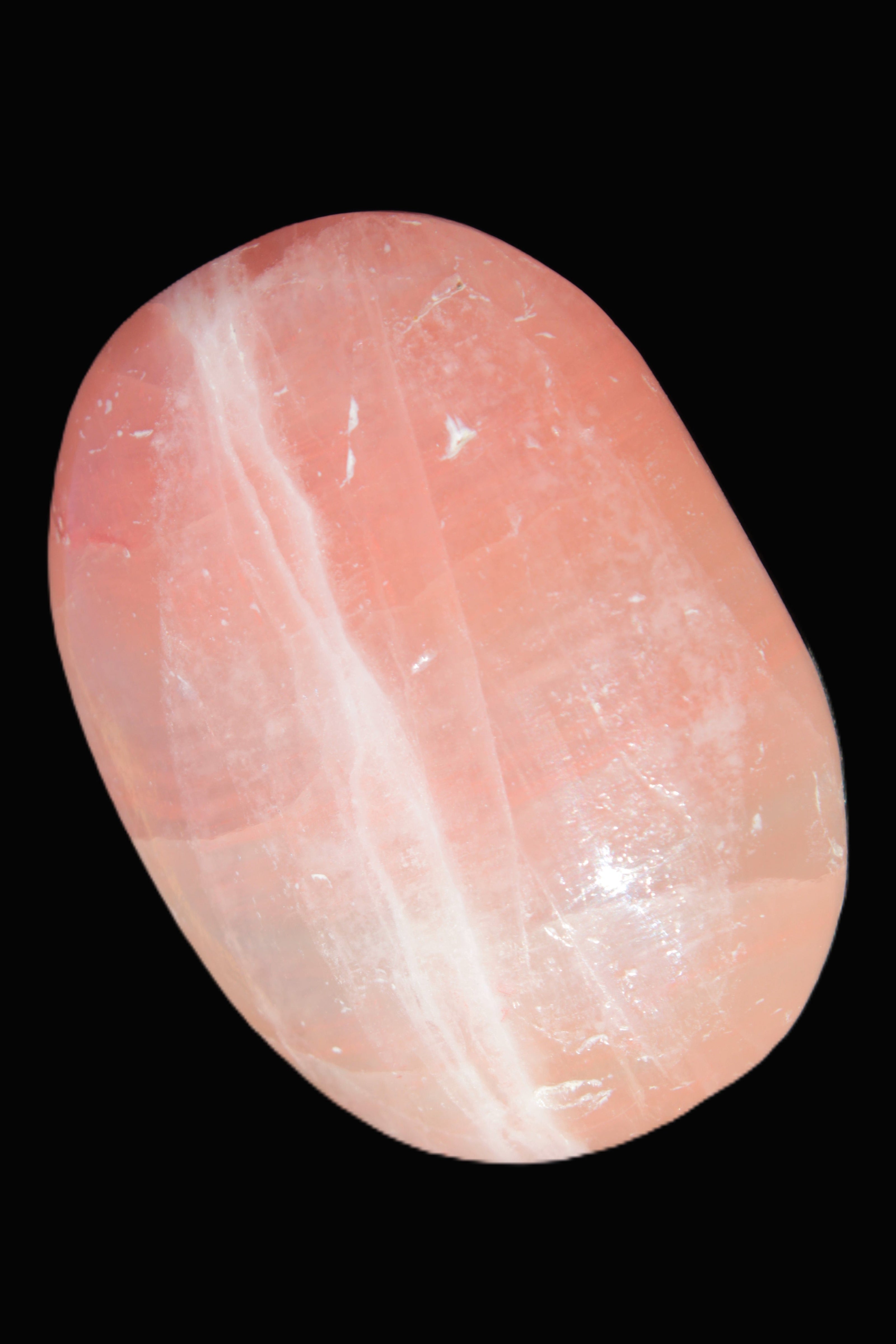 Pink Sorbet Calcite palm stone 57-61mm 71-117g in sunlight - Rocks and Things Store