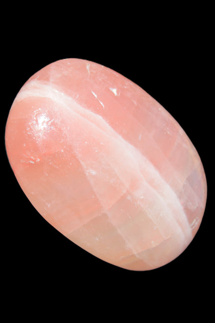 Pink Sorbet Calcite palm stone 57-61mm 71-117g in sunlight - Rocks and Things Store