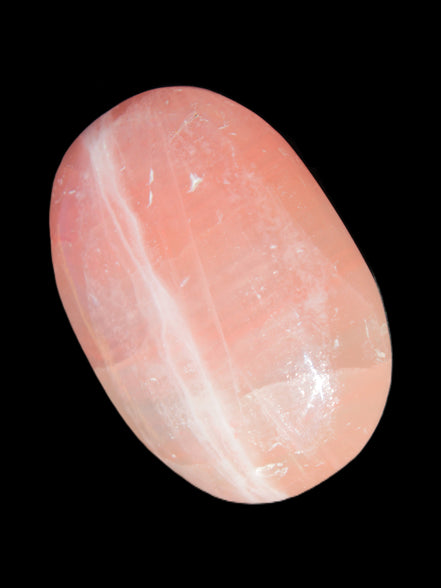 Pink Sorbet Calcite palm stone 57-61mm 71-117g in sunlight - Rocks and Things Store
