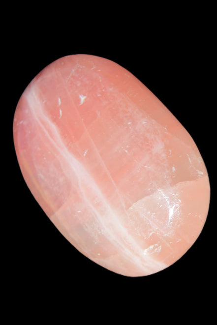 Pink Sorbet Calcite palm stone 57-61mm 71-117g in sunlight - Rocks and Things Store