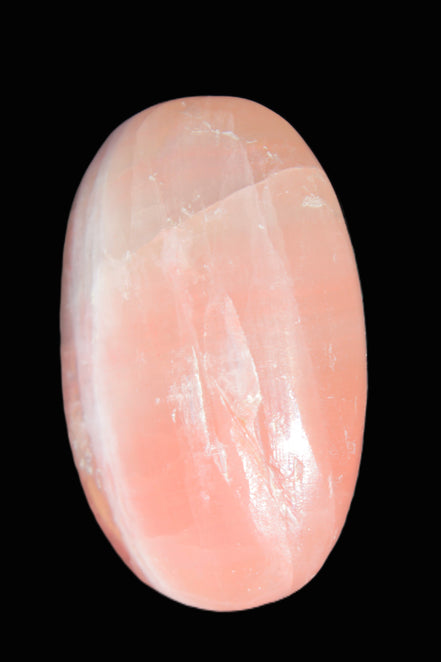 Pink Sorbet Calcite palm stone 57-61mm 71-117g in sunlight - Rocks and Things Store