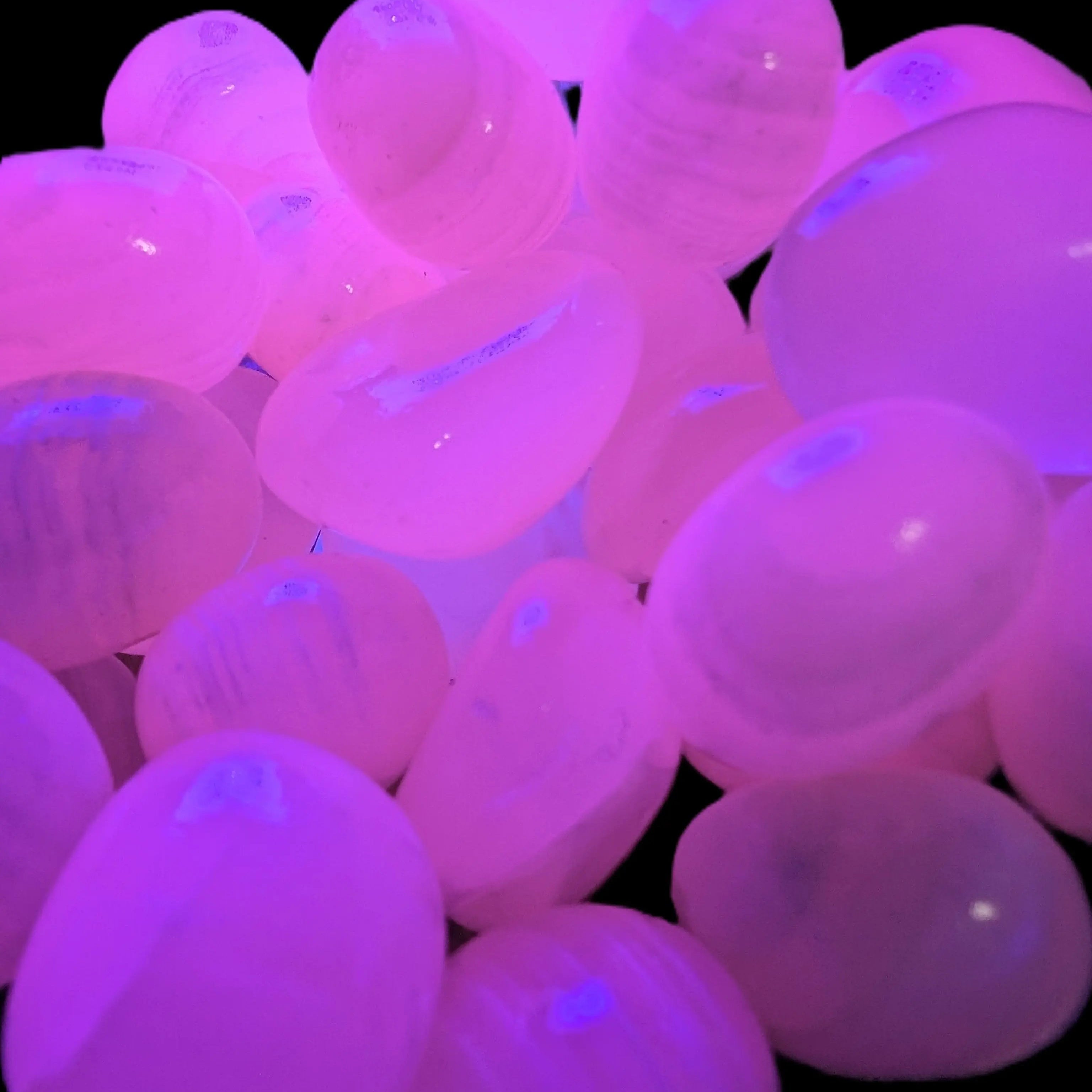 Mangano Calcite UV bright-pink-reactive tumbled stone 4-6g Rocks and Things