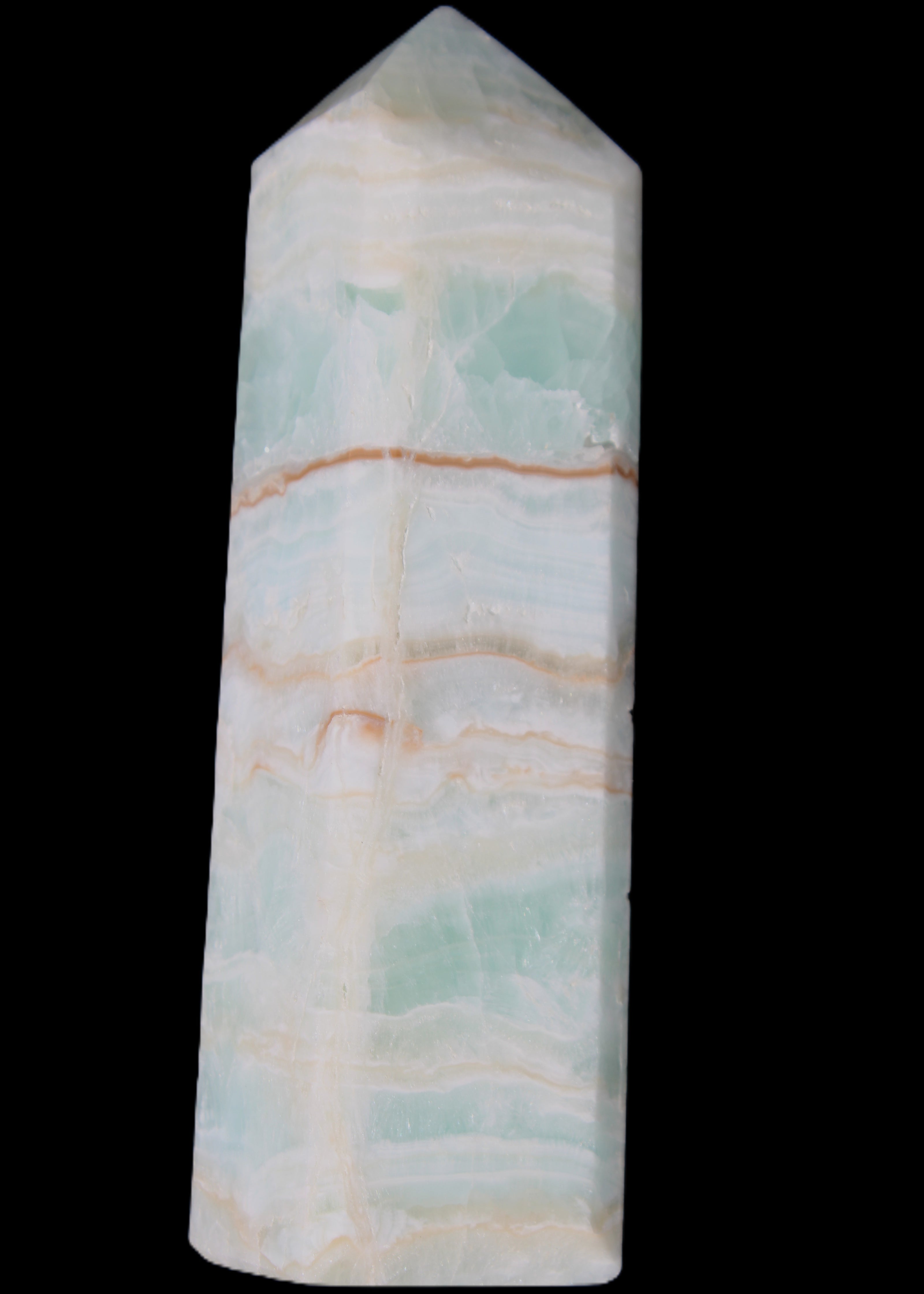 Pistachio Calcite obelisk 131*37*30mm 324g in sunlight - Rocks and Things Store