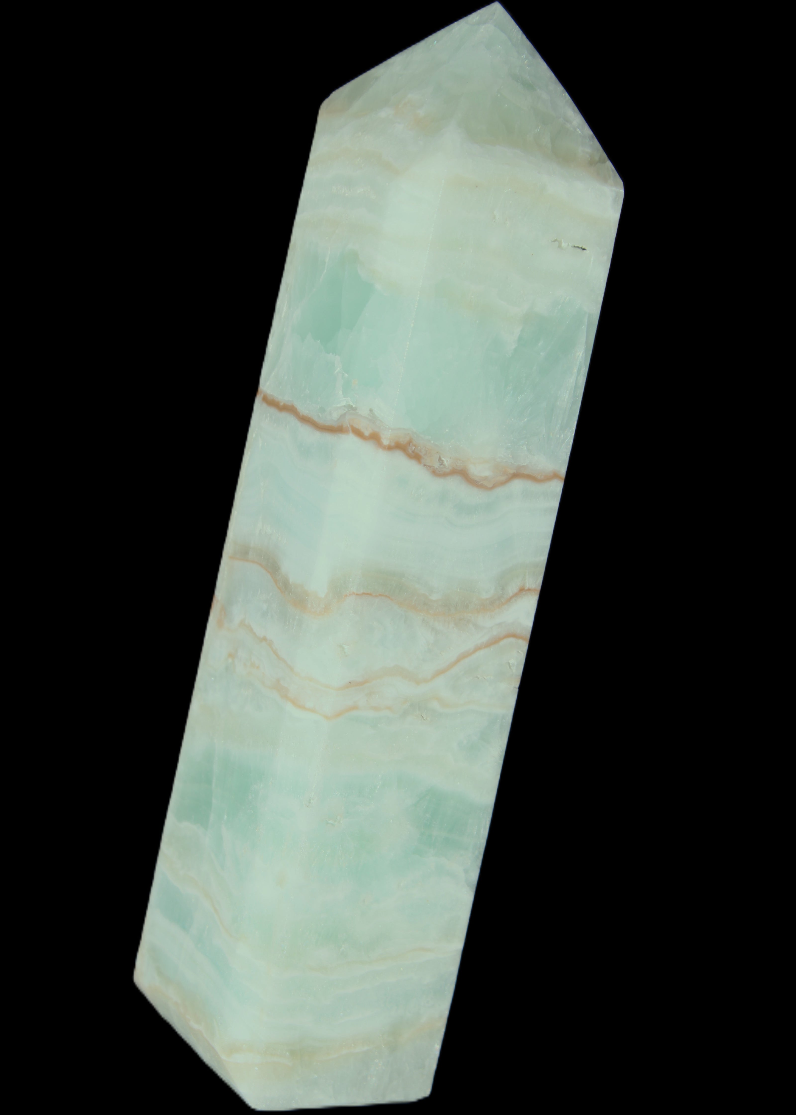 Pistachio Calcite obelisk 131*37*30mm 324g in sunlight - Rocks and Things Store
