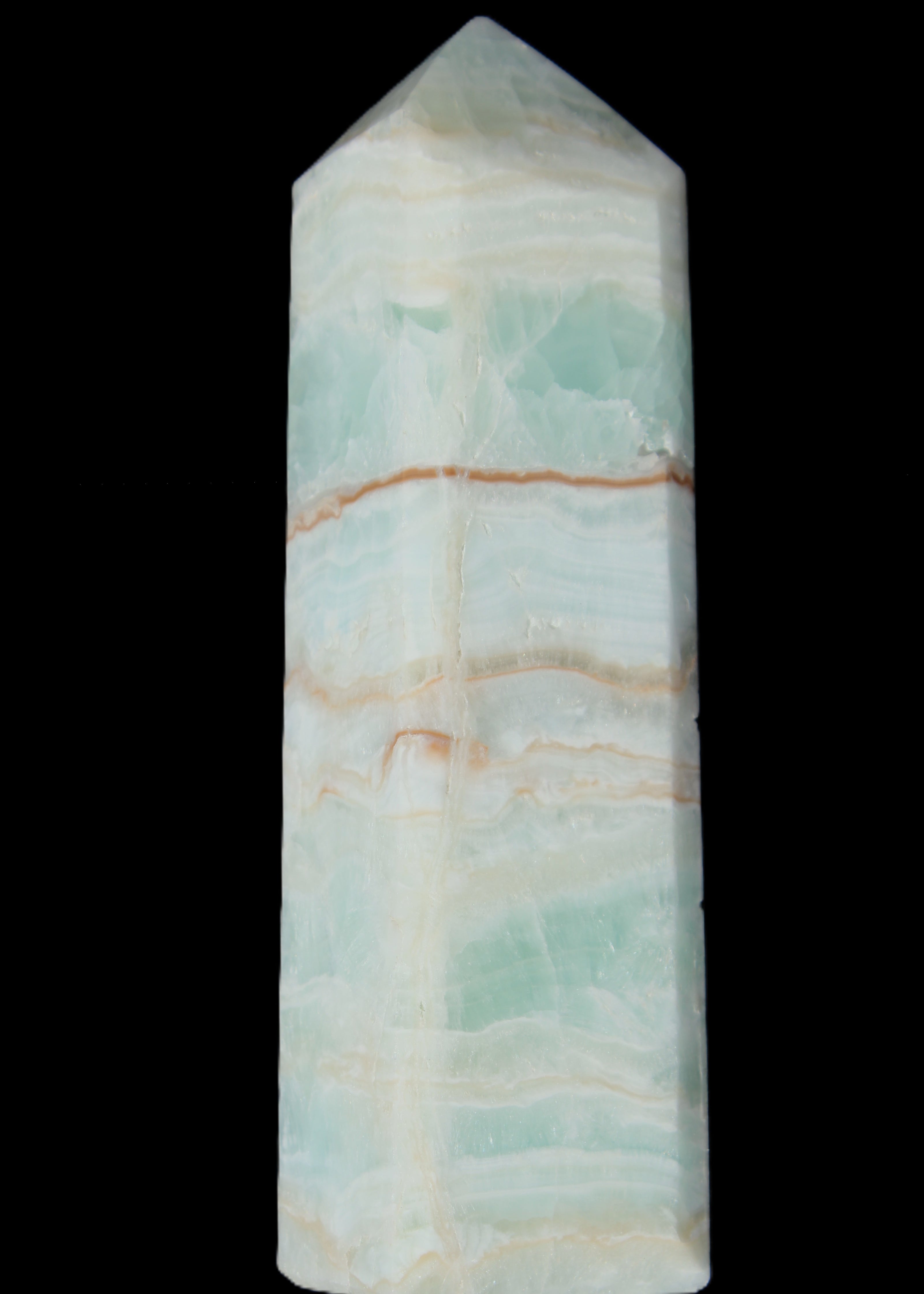 Pistachio Calcite obelisk 131*37*30mm 324g in sunlight - Rocks and Things Store