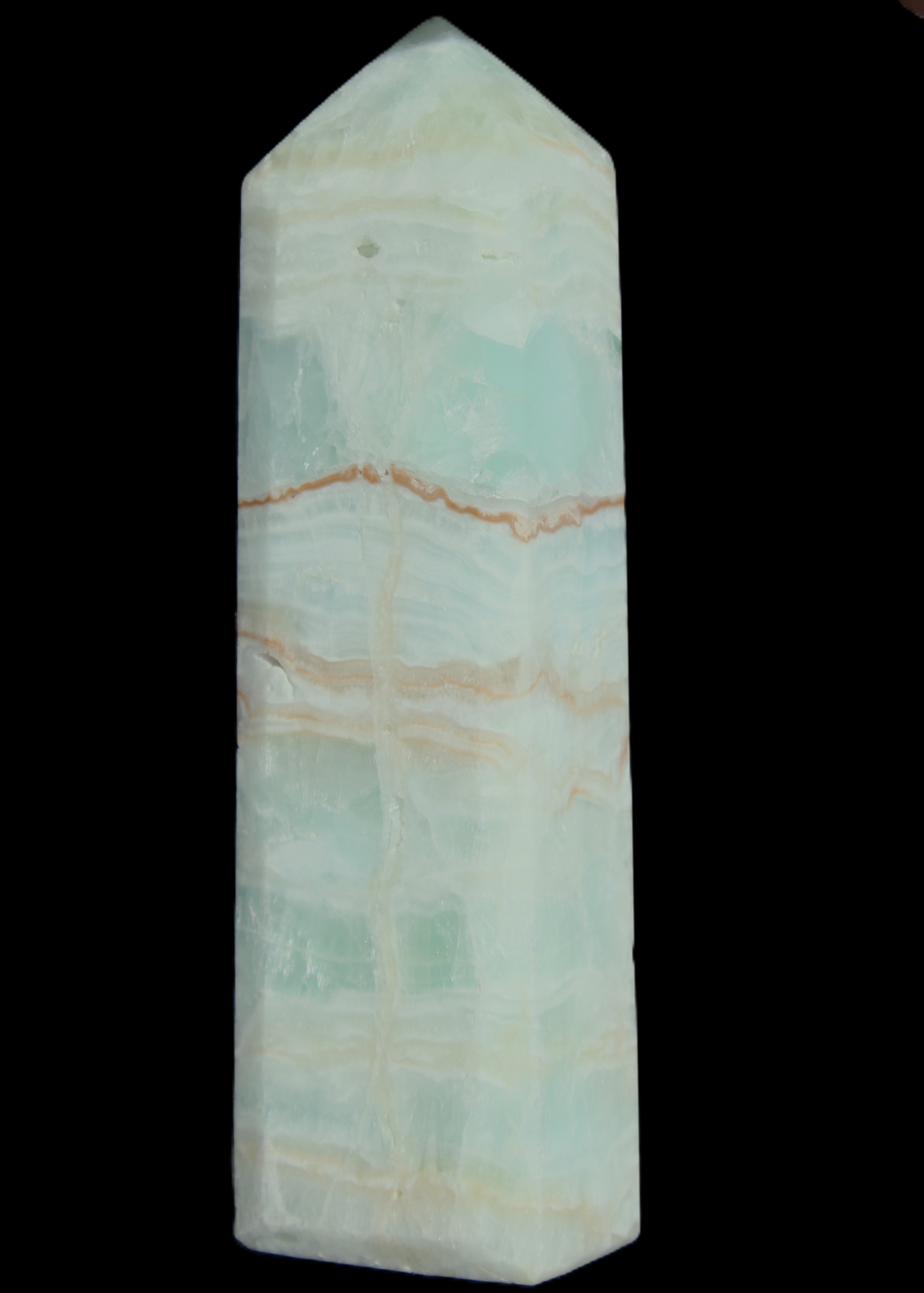 Pistachio Calcite obelisk 131*37*30mm 324g in sunlight - Rocks and Things Store