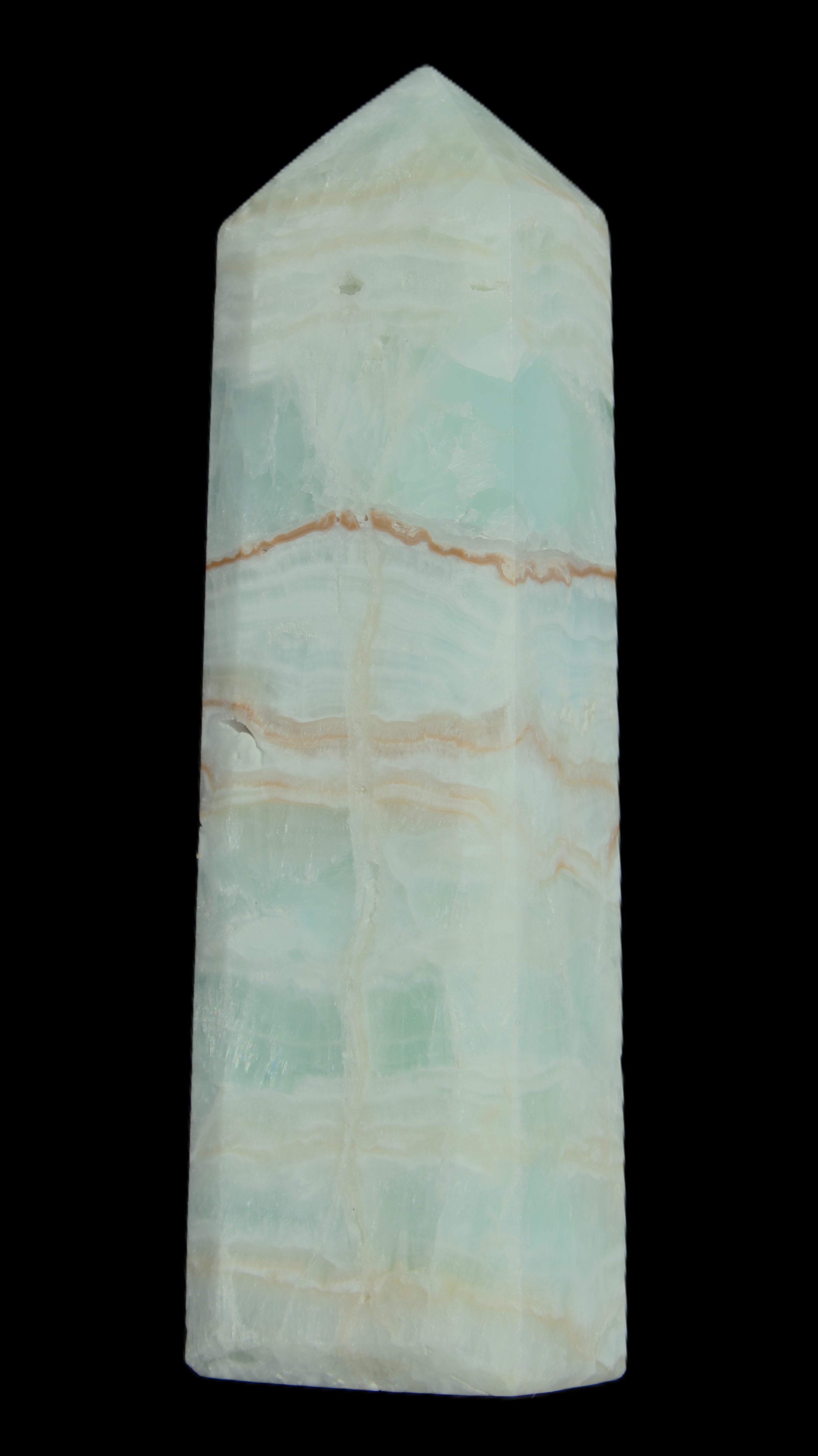 Pistachio Calcite obelisk 131*37*30mm 324g in sunlight - Rocks and Things Store
