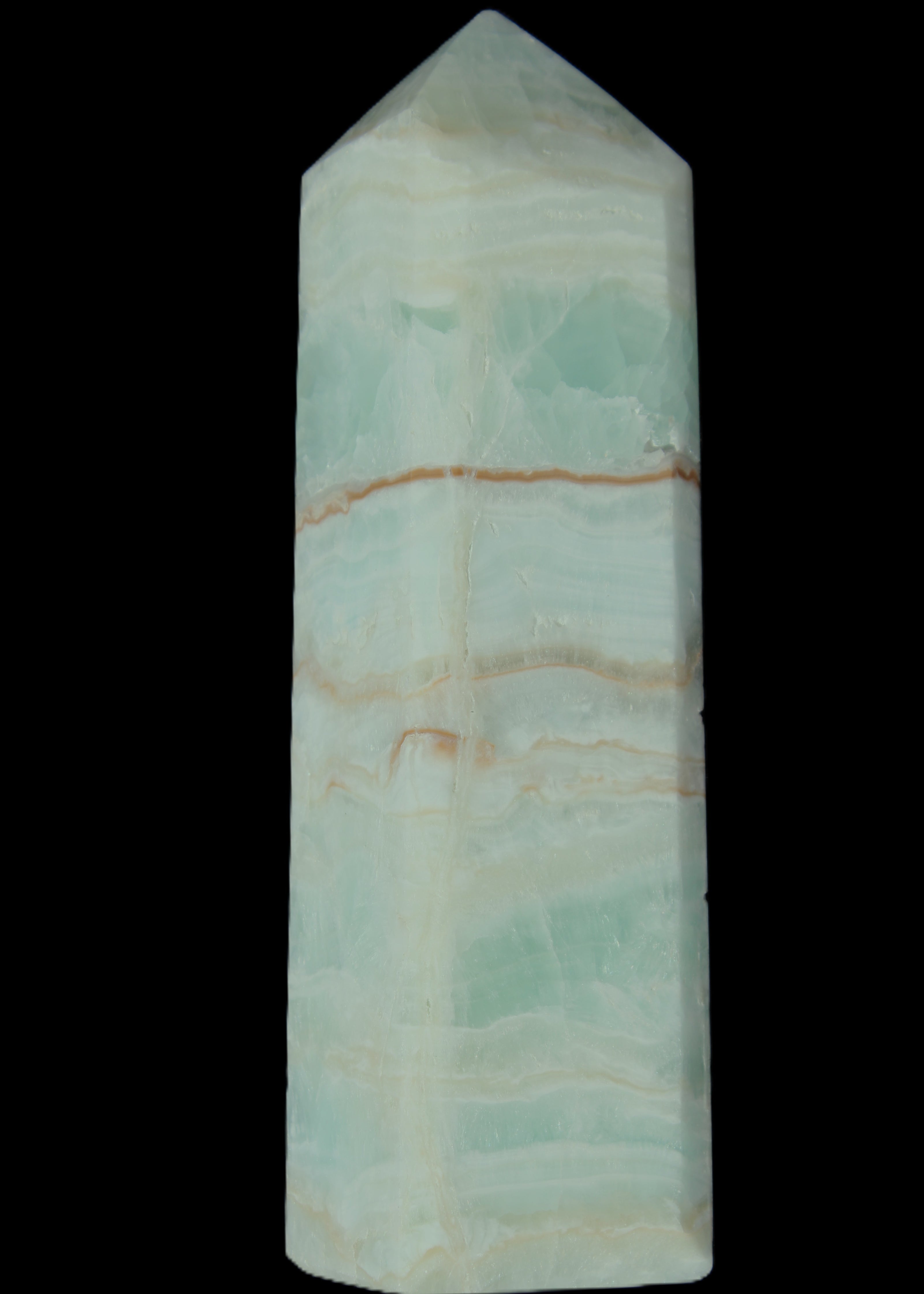 Pistachio Calcite obelisk 131*37*30mm 324g in sunlight - Rocks and Things Store