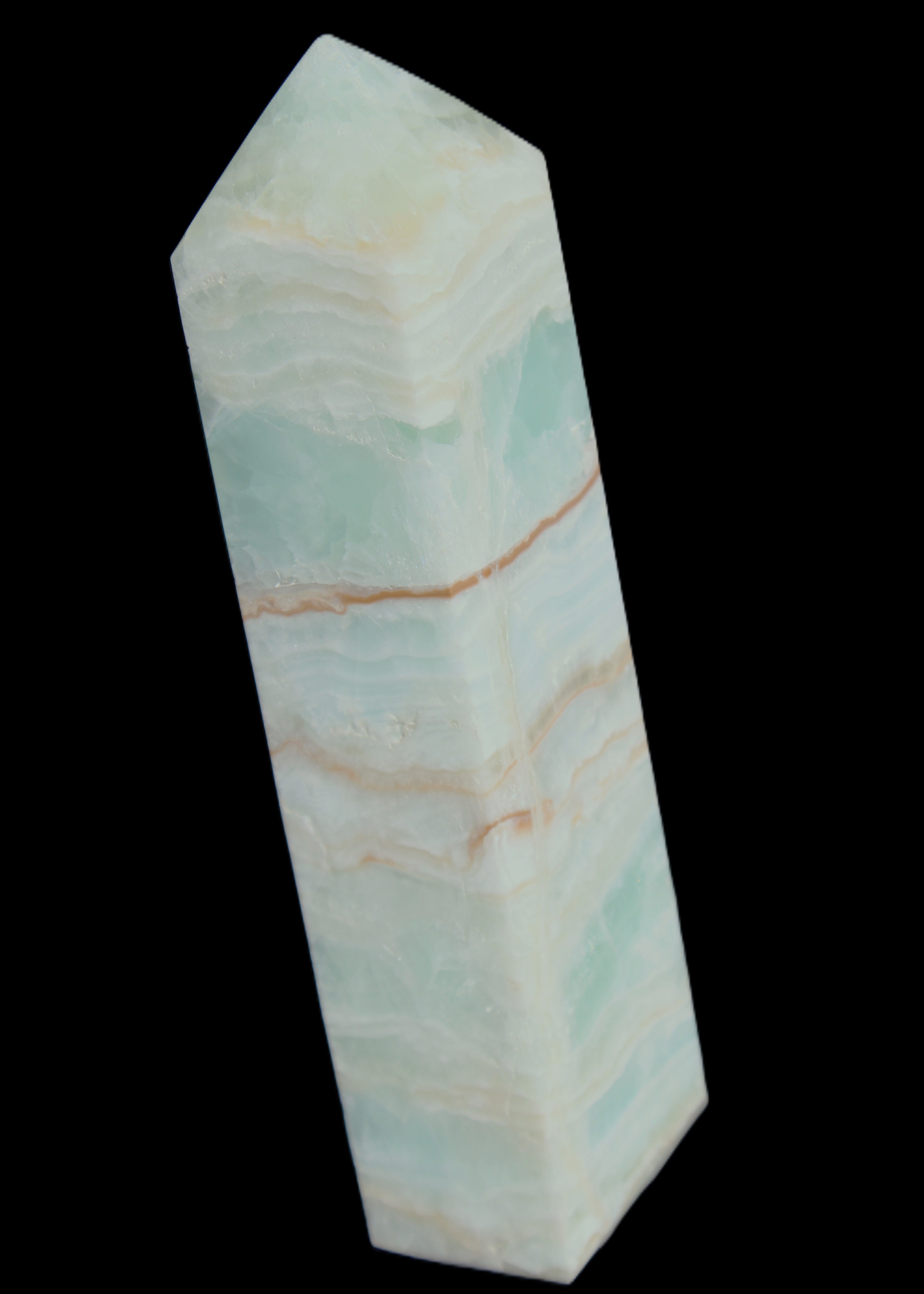 Pistachio Calcite obelisk 131*37*30mm 324g in sunlight - Rocks and Things Store