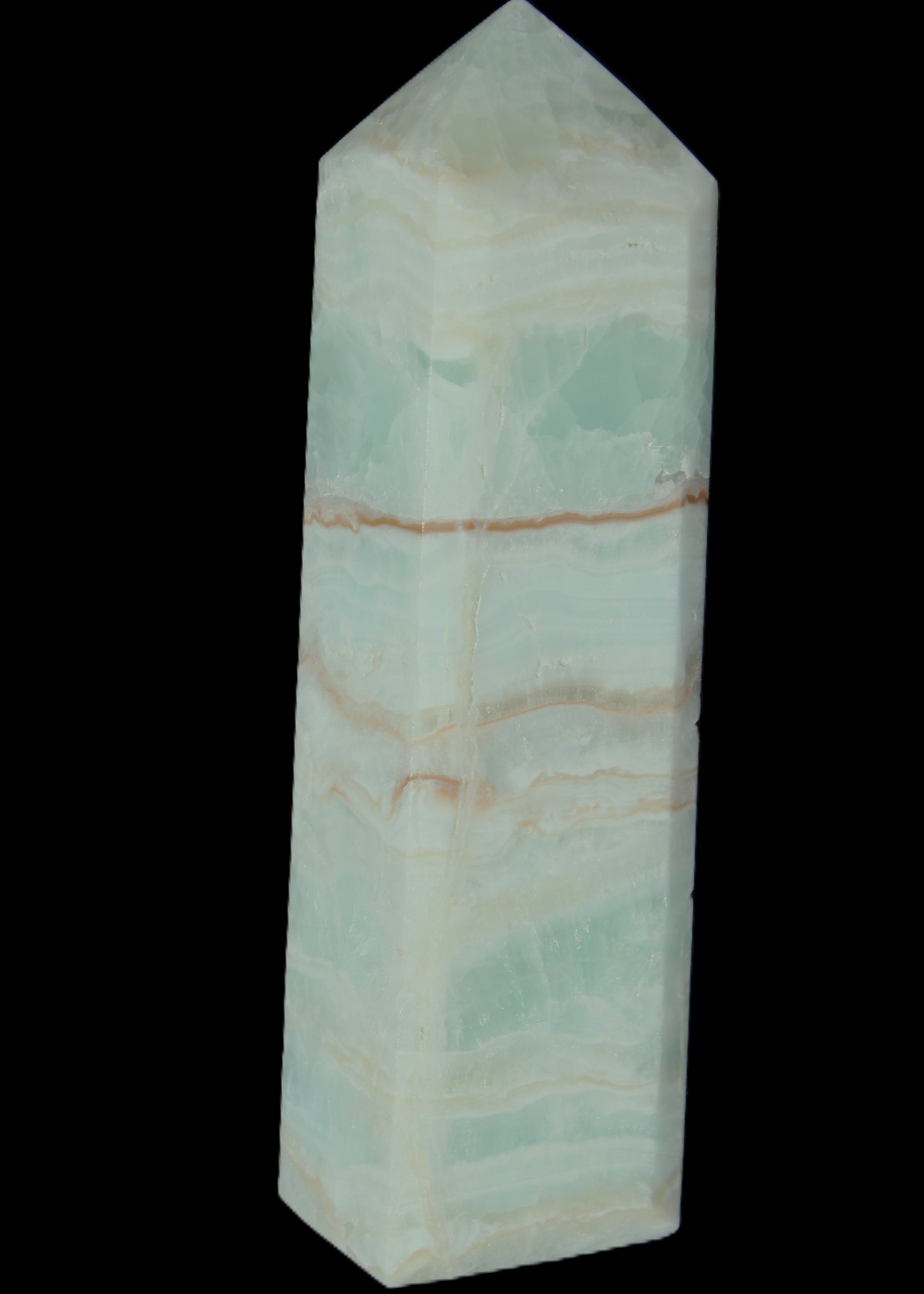Pistachio Calcite obelisk 131*37*30mm 324g in sunlight - Rocks and Things Store
