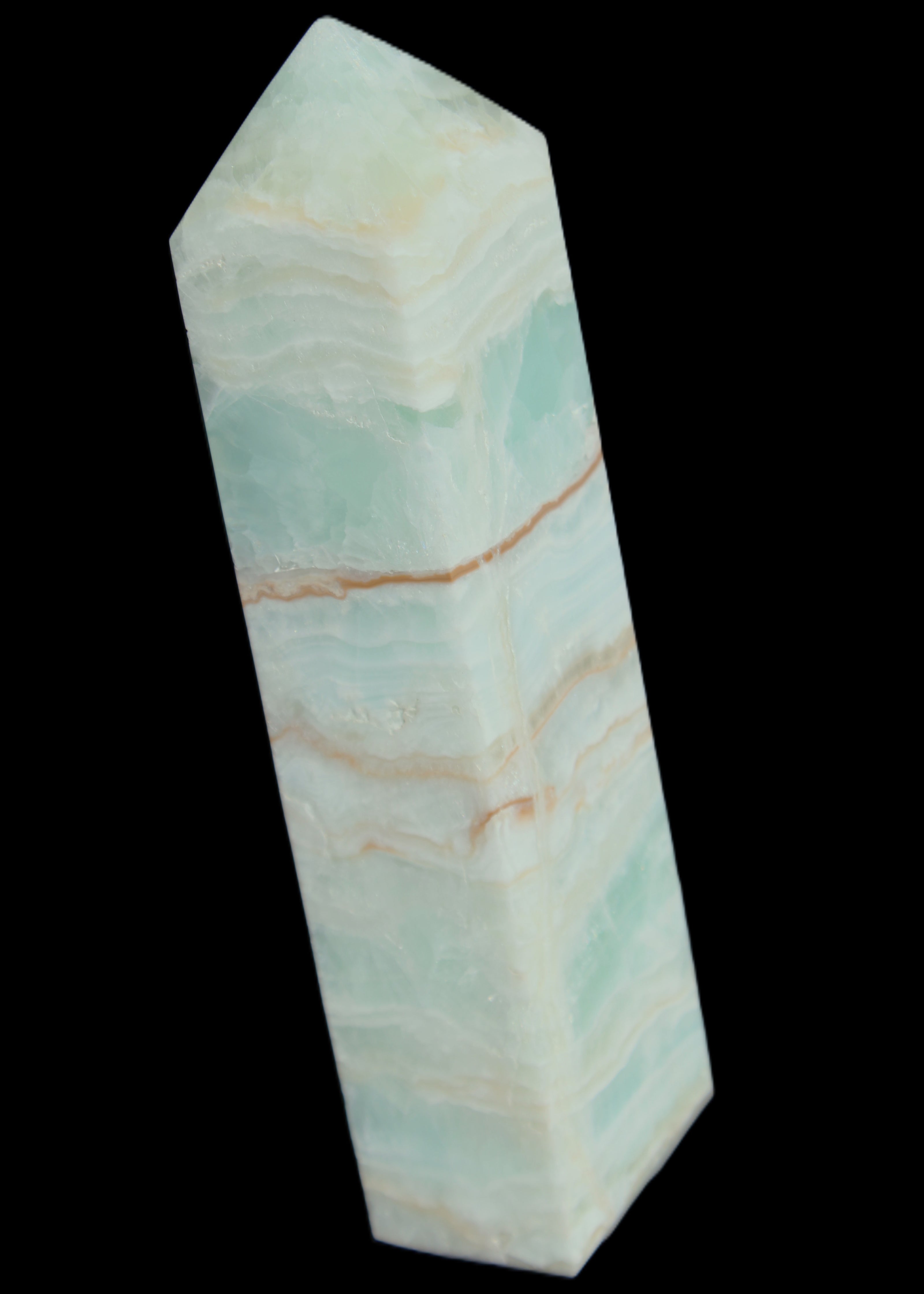 Pistachio Calcite obelisk 131*37*30mm 324g in sunlight - Rocks and Things Store