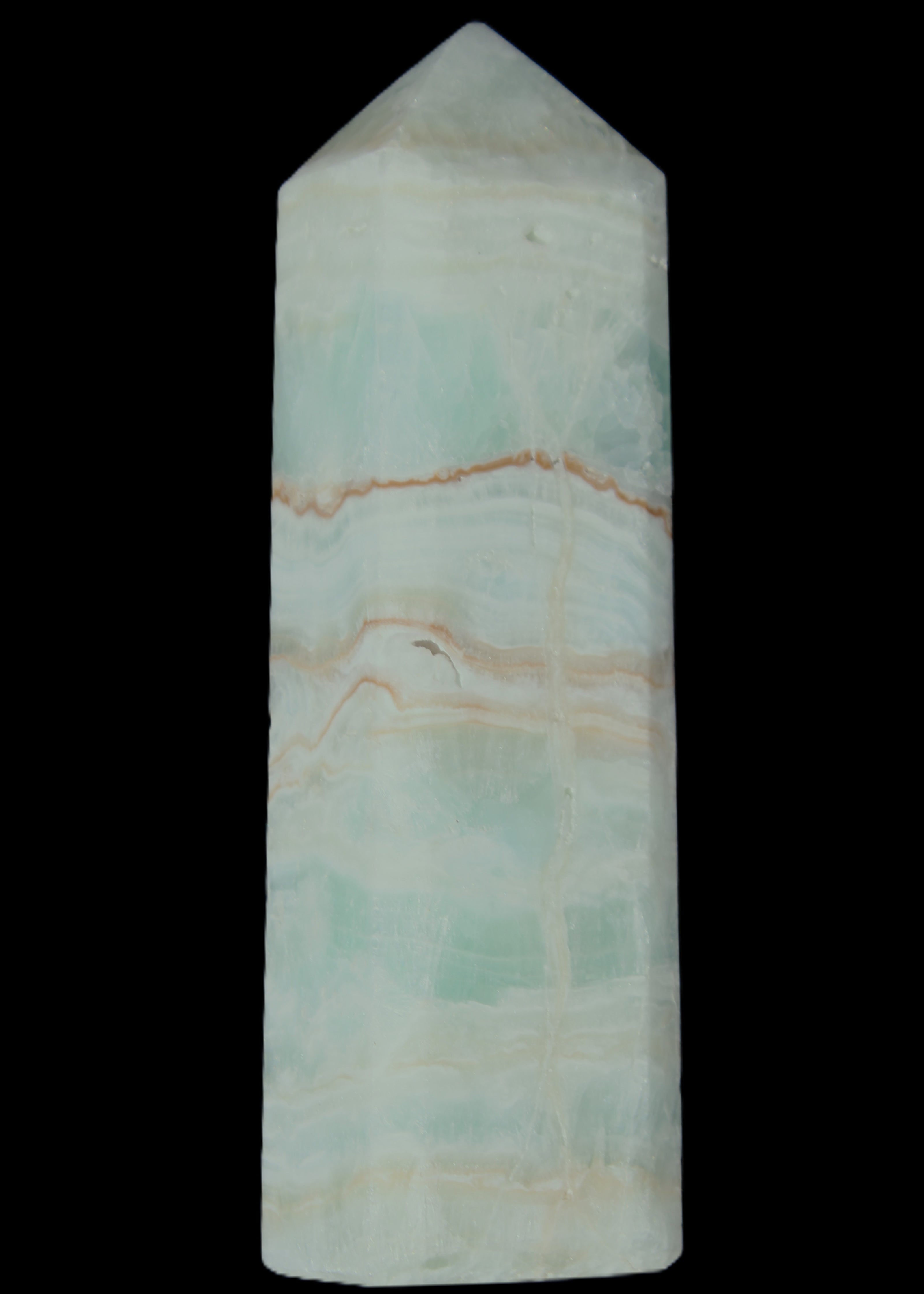 Pistachio Calcite obelisk 131*37*30mm 324g in sunlight - Rocks and Things Store