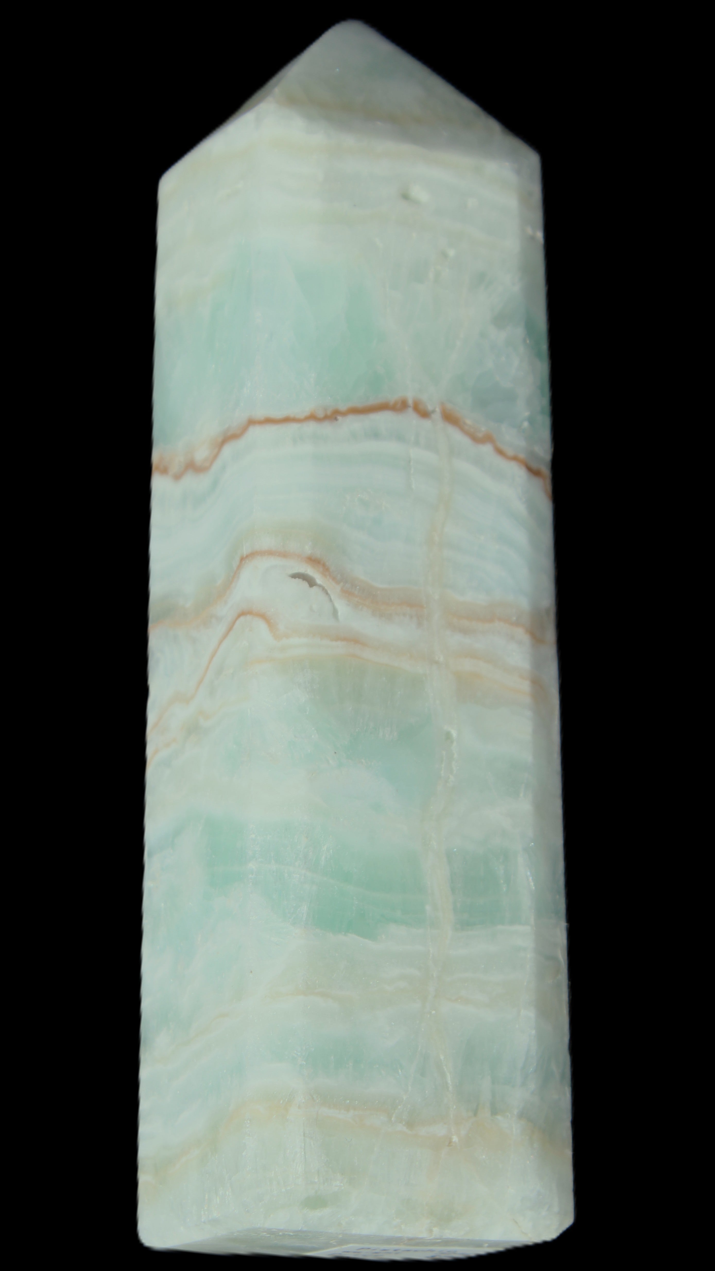 Pistachio Calcite obelisk 131*37*30mm 324g in sunlight - Rocks and Things Store
