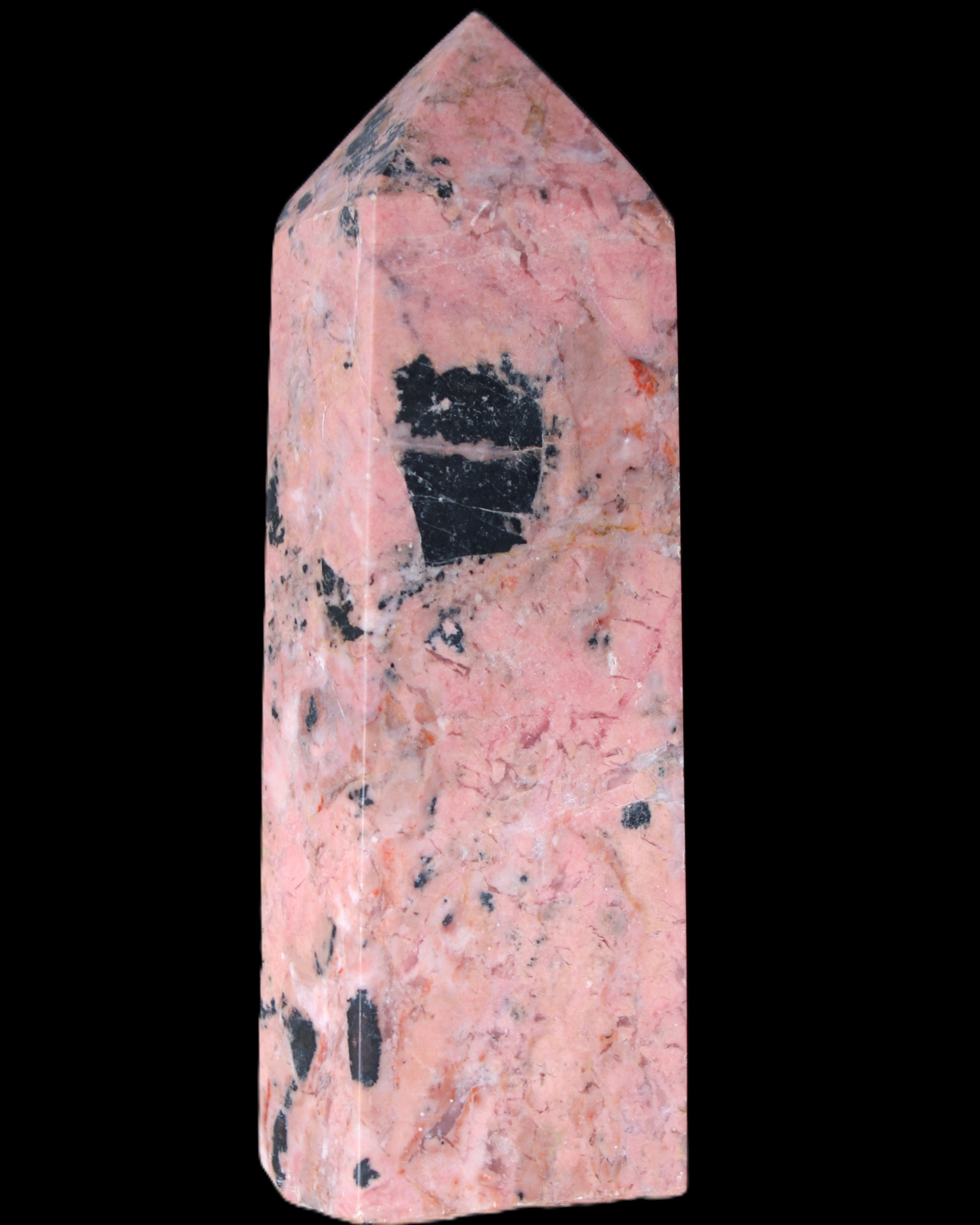 Peach Blossom Stone Rhodonite obelisk 505g in sunlight - Rocks and Things Store
