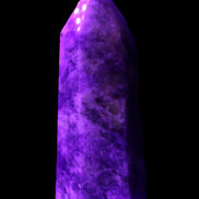 Amethyst obelisk 830g in UV light - Rocks and Things Store