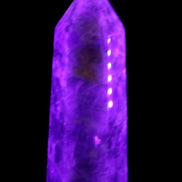 Amethyst obelisk 830g in UV light - Rocks and Things Store