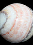 Rhodochrosite sphere 320g in sunlight - Rocks and Things Store