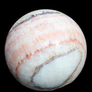Rhodochrosite sphere 320g in sunlight - Rocks and Things Store