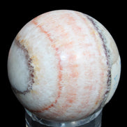 Rhodochrosite sphere 320g in sunlight - Rocks and Things Store