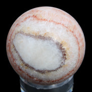 Rhodochrosite sphere 320g in sunlight - Rocks and Things Store