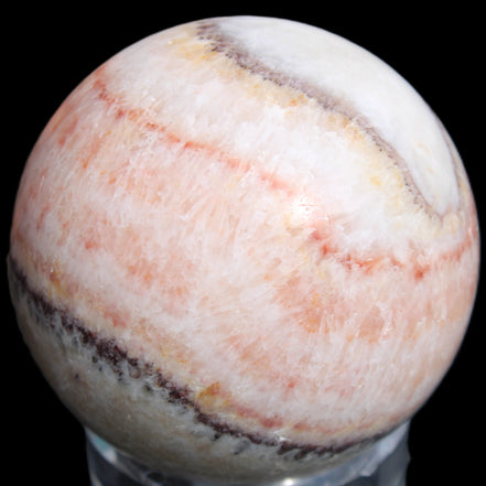 Rhodochrosite sphere 320g in sunlight - Rocks and Things Store