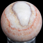 Rhodochrosite sphere 320g in sunlight - Rocks and Things Store