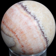 Rhodochrosite sphere 320g in sunlight - Rocks and Things Store