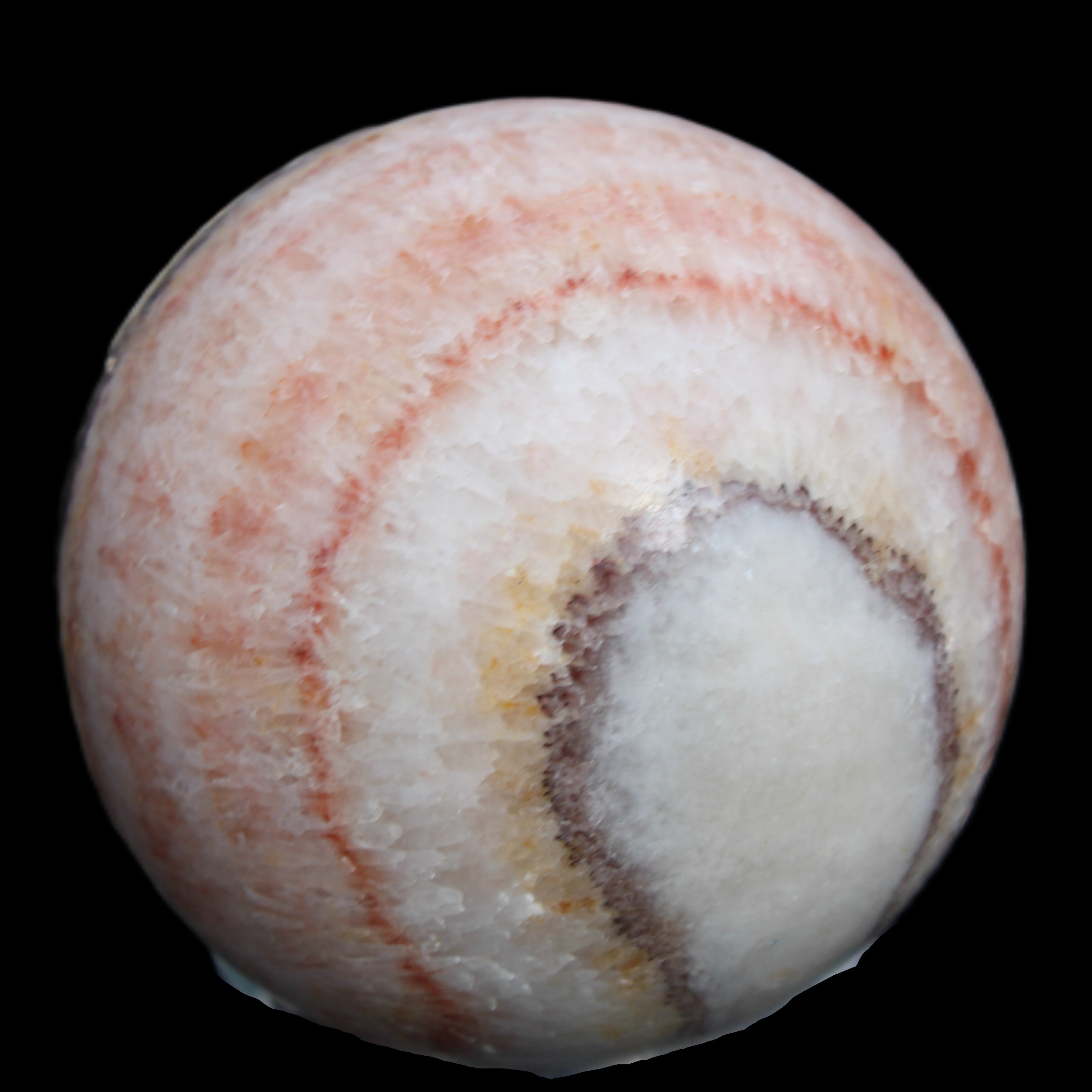 Rhodochrosite sphere 320g in sunlight - Rocks and Things Store