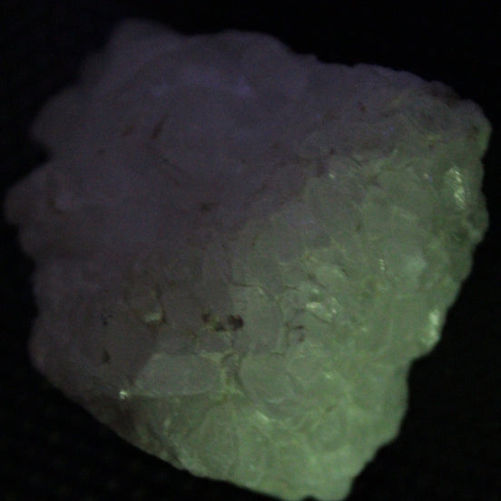 Calcite UV-reactive crystal cluster 130g in UV light 365nm