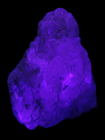 Calcite UV-reactive crystal cluster 130g in UV light 395nm