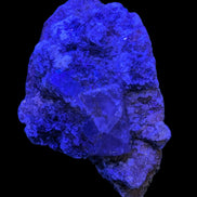 Purple Cubic ladder Fluorite with Aluminum Fluoride Gypsum 272g in UV light - Rocks and Things Store