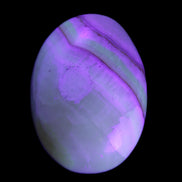 Yellow Banded Calcite egg 118g in UV light - Rocks and Things Store