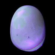 Yellow Banded Calcite egg 118g in UV light - Rocks and Things Store