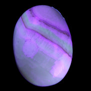 Yellow Banded Calcite egg 118g in UV light - Rocks and Things Store
