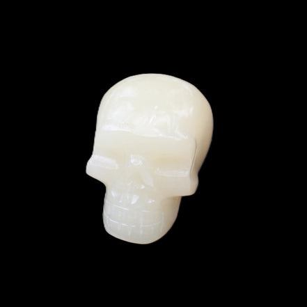 Honey Calcite skull hand-carved 55*47*38mm 183g in sunlight - Rocks and Things Store