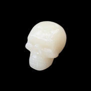 Honey Calcite skull hand-carved 55*47*38mm 183g in sunlight - Rocks and Things Store