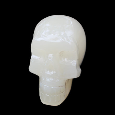 Honey Calcite skull hand-carved 55*47*38mm 183g in sunlight - Rocks and Things Store