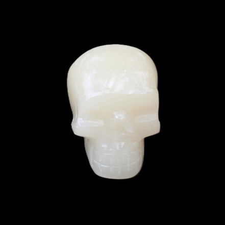 Honey Calcite skull hand-carved 55*47*38mm 183g in sunlight - Rocks and Things Store
