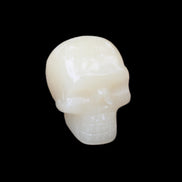 Honey Calcite skull hand-carved 55*47*38mm 183g in sunlight - Rocks and Things Store
