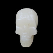 Honey Calcite skull hand-carved 55*47*38mm 183g in sunlight - Rocks and Things Store