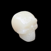 Honey Calcite skull hand-carved 55*47*38mm 183g in sunlight - Rocks and Things Store