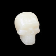 Honey Calcite skull hand-carved 55*47*38mm 183g in sunlight - Rocks and Things Store