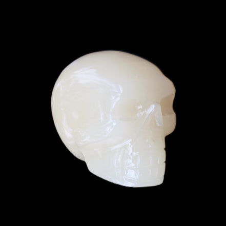 Honey Calcite skull hand-carved 55*47*38mm 183g in sunlight - Rocks and Things Store