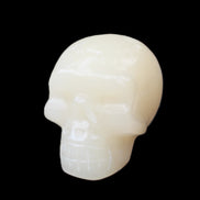 Honey Calcite skull hand-carved 55*47*38mm 183g in sunlight - Rocks and Things Store